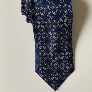 Authentic French handmade Hermes silk neck tie in a regal navy blue